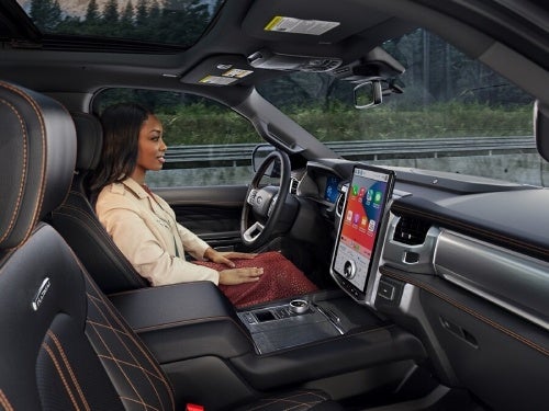 2024 Ford Expedition view of woman in the front seat taking advantage of the handsfree driving feature