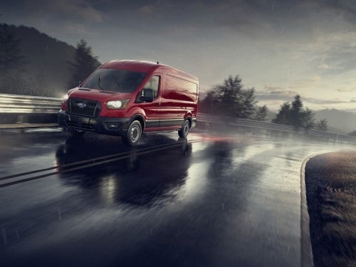 2024 Ford Transit driving on a wet road