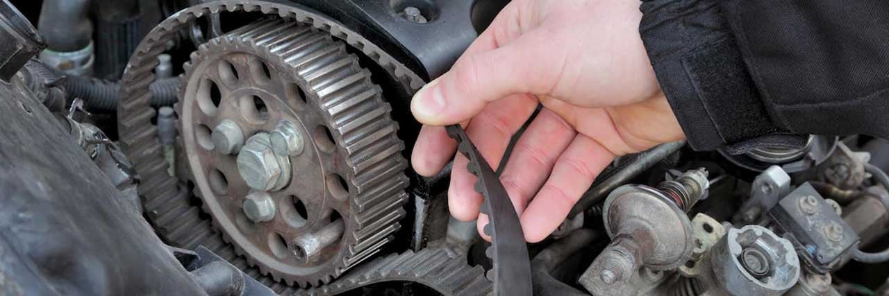 Service Technician Removing a Timing Belt