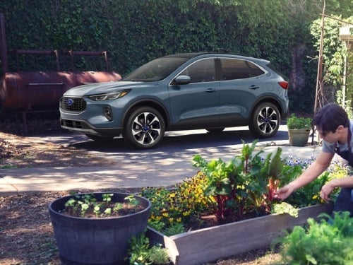 2024 Ford Escape exterior view of vehicle parked at a home surrounded by a flower bed