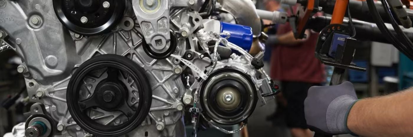 close up of an engine getting serviced